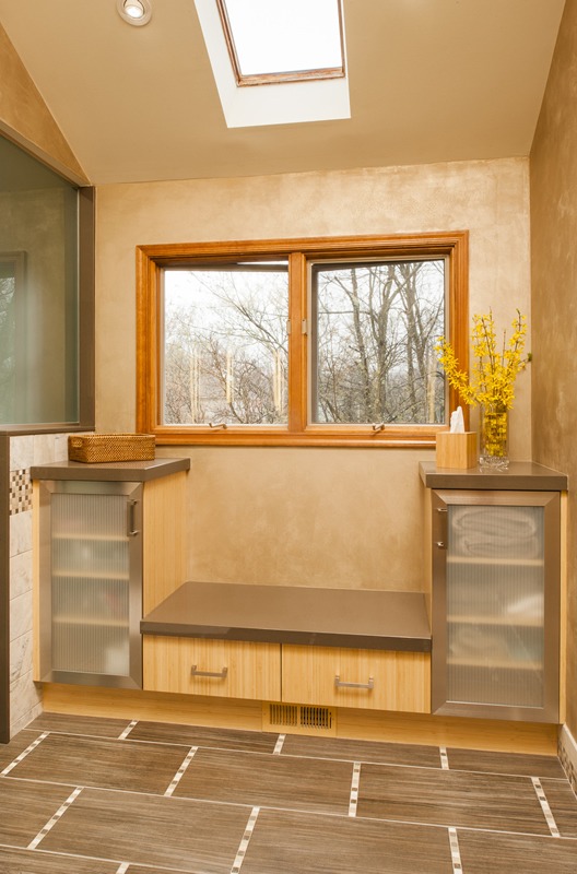 An Abbey's bathroom design, storage seat & drawers, frosted glass & stainless framed doors, quartz tops