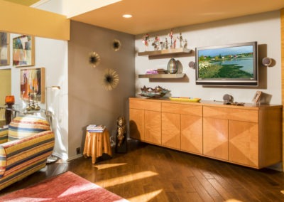 Abbey's custom design living room with exotic anigre wood veneer, floating cabinet