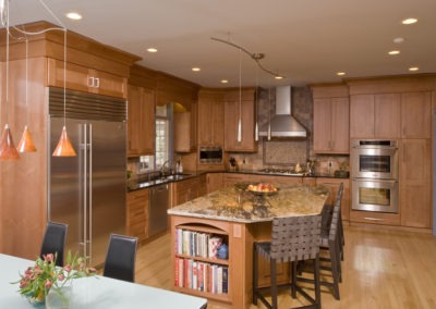 Abbey's custom kitchen design with modern wood cabinets and prep island