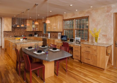 Abbey's modern custom design kitchen with highly polished red birch cabinets