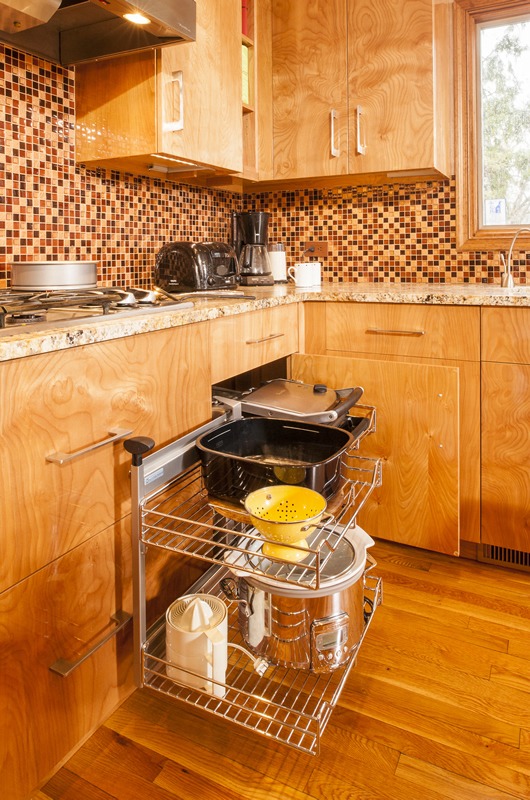 Abbey's modern custom design kitchen includes unique cabinet pull-outs