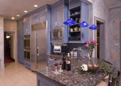 Abbey's custom design kitchen with trendy blue cabinets and stainless accents