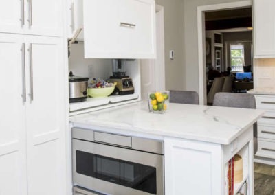 Abbey's custom kitchen with modern white cabinets