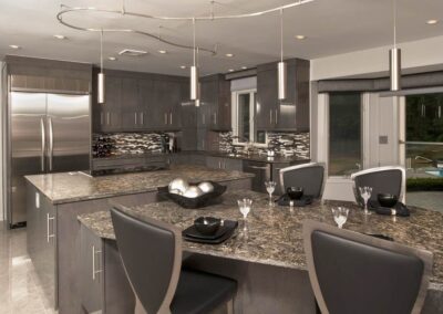 Abbey's custom design modern kitchen, gloss-gray cabinets with stainless accents