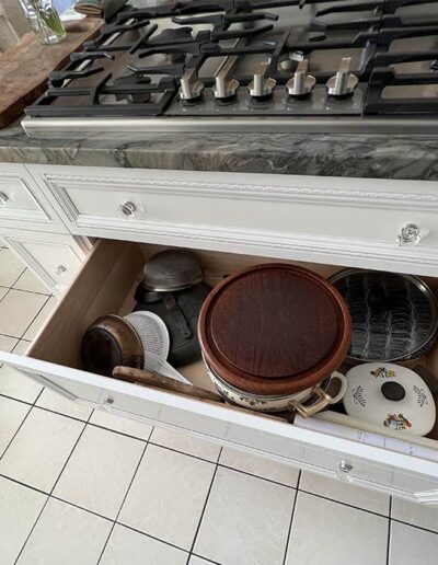 Cookware storage drawer under gas range