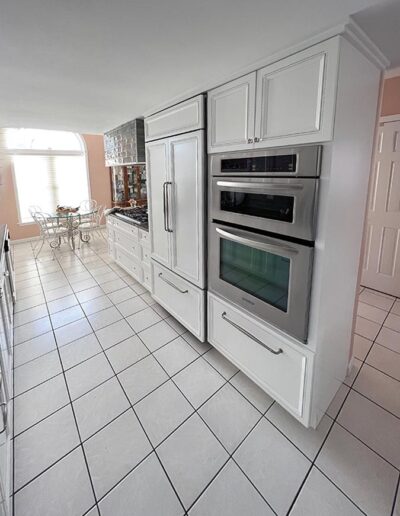 View of ovens, refrigerator, range and breakfast area