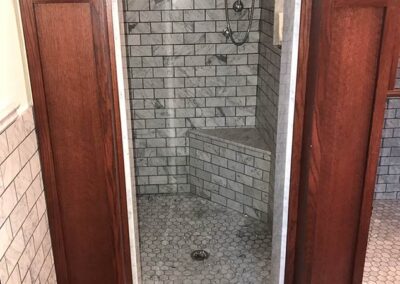Antique looking modern shower, door to inside