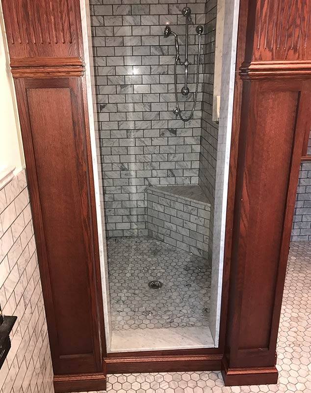 Antique looking modern shower, door to inside